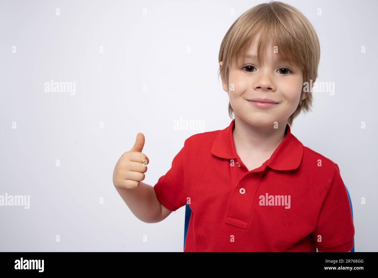 Thumbs up! Smiling happy cute boy, studio shot, isolated on white Stock ...