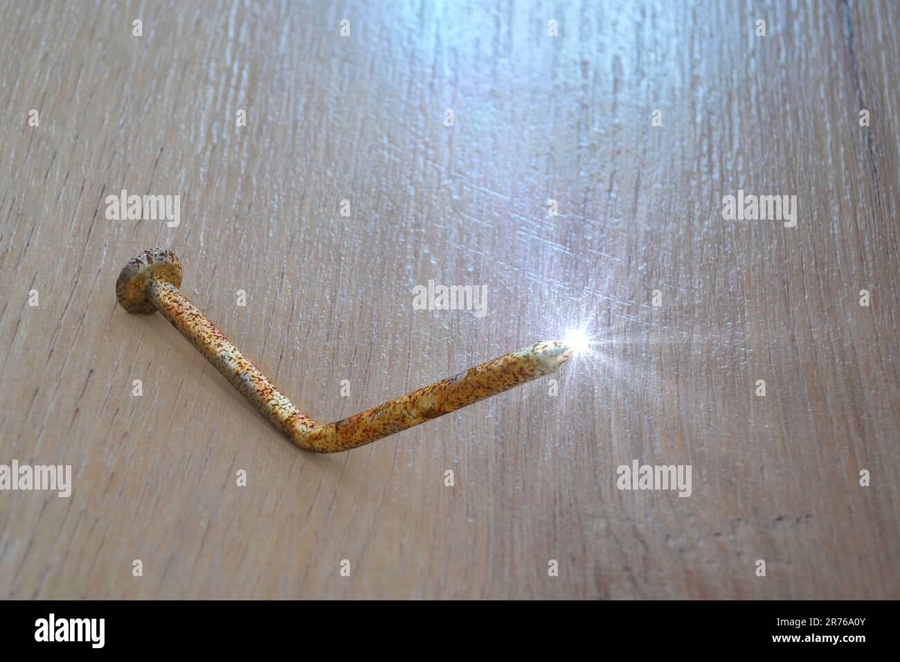 Rusty old bent metal nail, computer illustration. Old nails and other dirty objects are potential source of tetanus bacteria transmitted by infected w Stock Photo