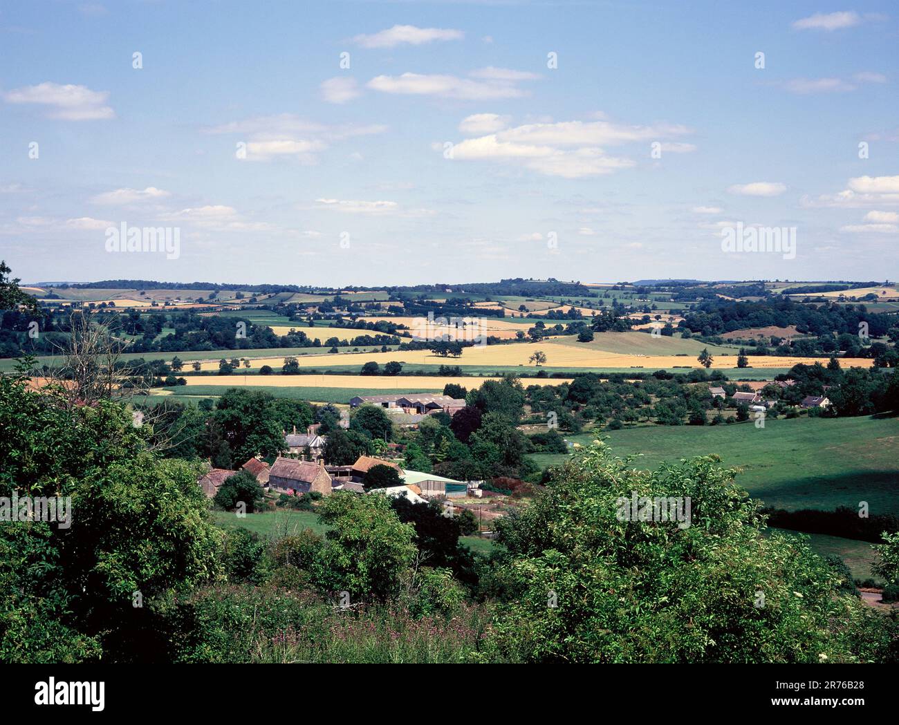 England. Somerset. South Cadbury. View of rural countryside & farmhouse from Cadbury Castle mound. Stock Photo