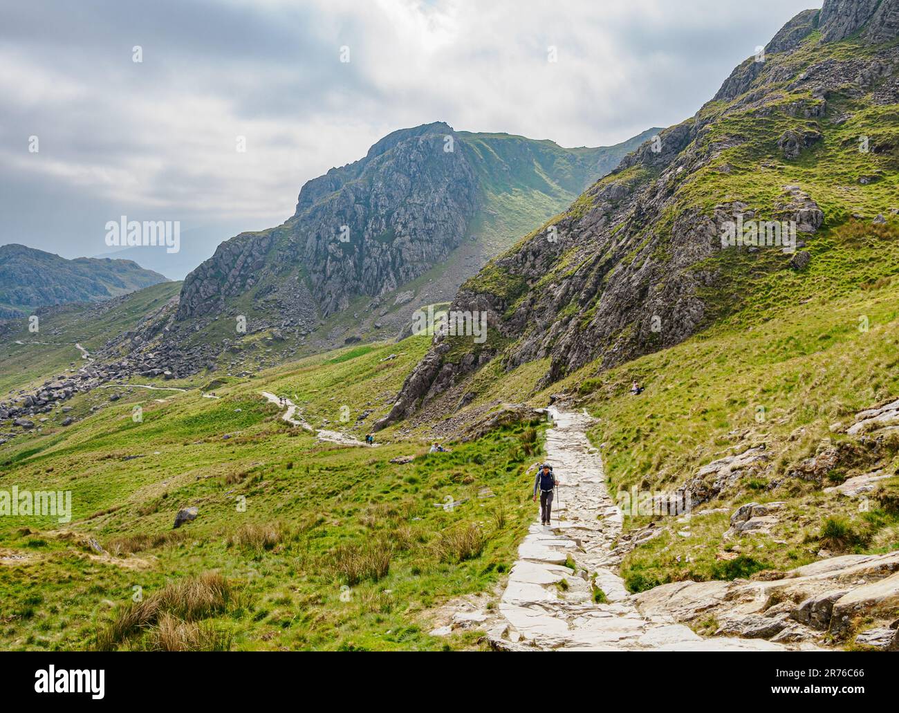 Walkers ascending the Pyg Track from Pen y Pass a popular route towards the summit ridge of Yr Wyddfa in the Snowdonia National Park North Wales Stock Photo