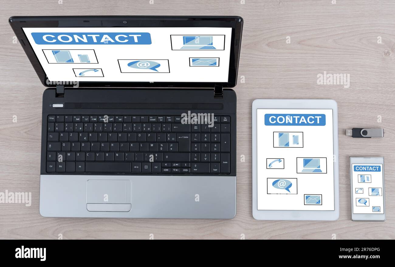 Contact concept shown on different information technology devices Stock Photo