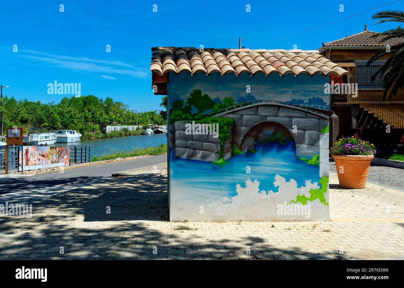 France, Herault, Villeneuve les Beziers, Place Michel Solans, olive tree  planted in the middle of a traffic circle Stock Photo - Alamy