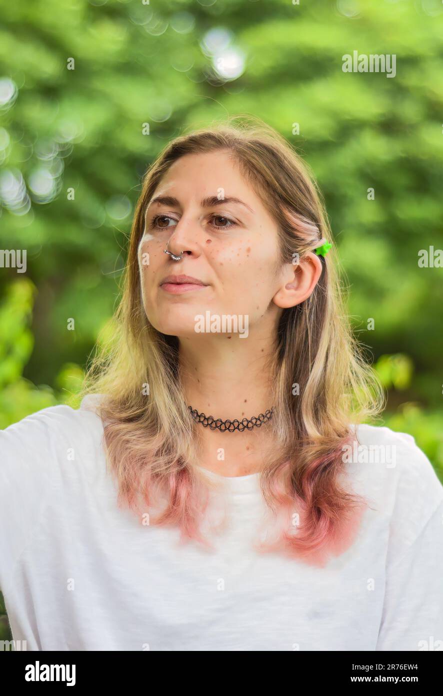 Portrait of beautiful woman with pink hair looking sideways Stock Photo