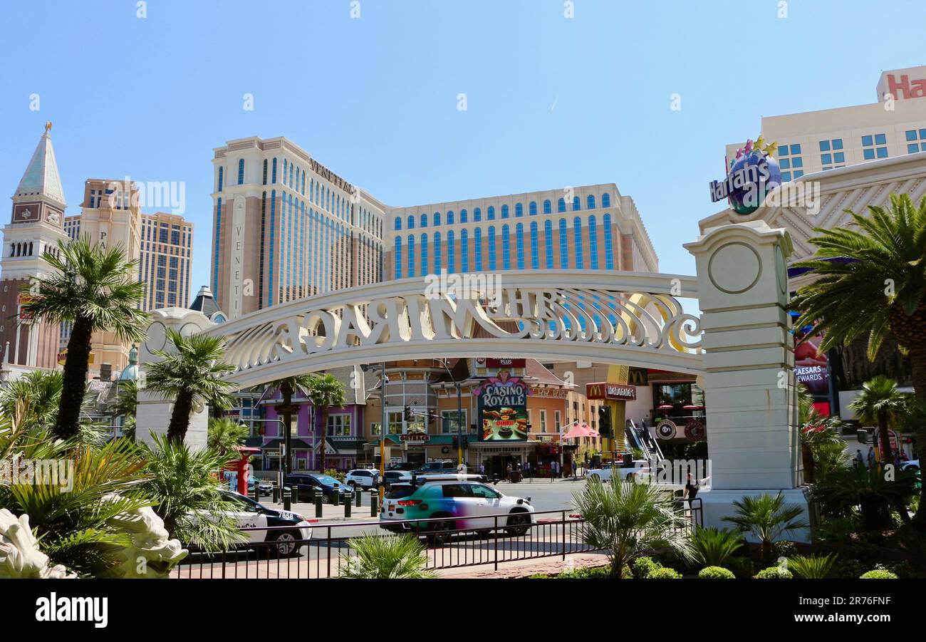The arch at the entrance to the Mirage casino and hotel Las Vegas Strip with the Venetian Casino Royale and Harrah's Las Vegas Nevada USA Stock Photo
