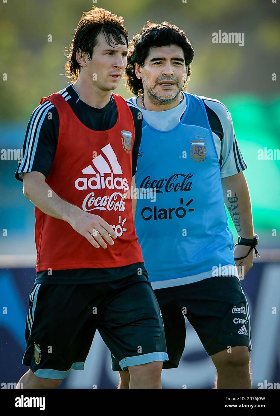 - - -FILE PHOTO - - - - Argentina's football team coach Diego Maradona (R) speaks with forward Lionel Messi during a training session in Ezeiza, Buenos Aires on March 24, 2009. Argentina will face Venezuela next March 28 for their FIFA World Cup South Africa 2010 qualifier at the Monumental stadium in Buenos Aires, Argentina.  (Photo by Alejandro Pagni/PHOTOXPHOTO) Stock Photo