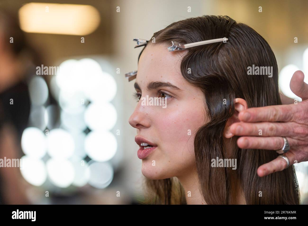 London, UK.  13 June 2023. A model in hair and make-up ahead of their catwalk show at Graduate Fashion Week at the Truman Brewery.  The event recognises the Class of 2023 across 26 BA fashion degree disciplines in specially curated runway shows of top design talent from across the UK and runs to 15 June. Credit: Stephen Chung / Alamy Live News Stock Photo