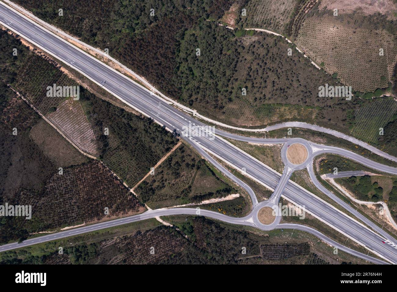 High angle aerial view of roundabout exit points for vehicles from