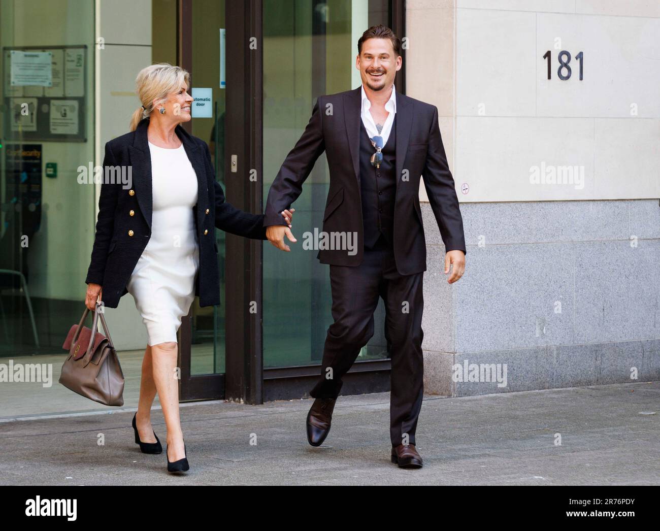 Lee Ryan leaves Westminster Magistrates' Court with his mother Sheila after applying to withdraw his guilty plea for drunkenly assaulting a police officer during his arrest for abusing a black flight attendant. Mr Ryan was found guilty at Ealing Magistrates' Court in January of racially aggravated common assault by beating and behaving in an abusive way towards the cabin crew member, while pleading guilty to assaulting a police officer by biting him. Picture date: Tuesday June 13, 2023. Stock Photo