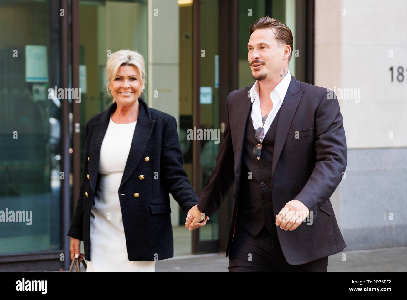 Lee Ryan leaves Westminster Magistrates' Court with his mother Sheila after applying to withdraw his guilty plea for drunkenly assaulting a police officer during his arrest for abusing a black flight attendant. Mr Ryan was found guilty at Ealing Magistrates' Court in January of racially aggravated common assault by beating and behaving in an abusive way towards the cabin crew member, while pleading guilty to assaulting a police officer by biting him. Picture date: Tuesday June 13, 2023. Stock Photo