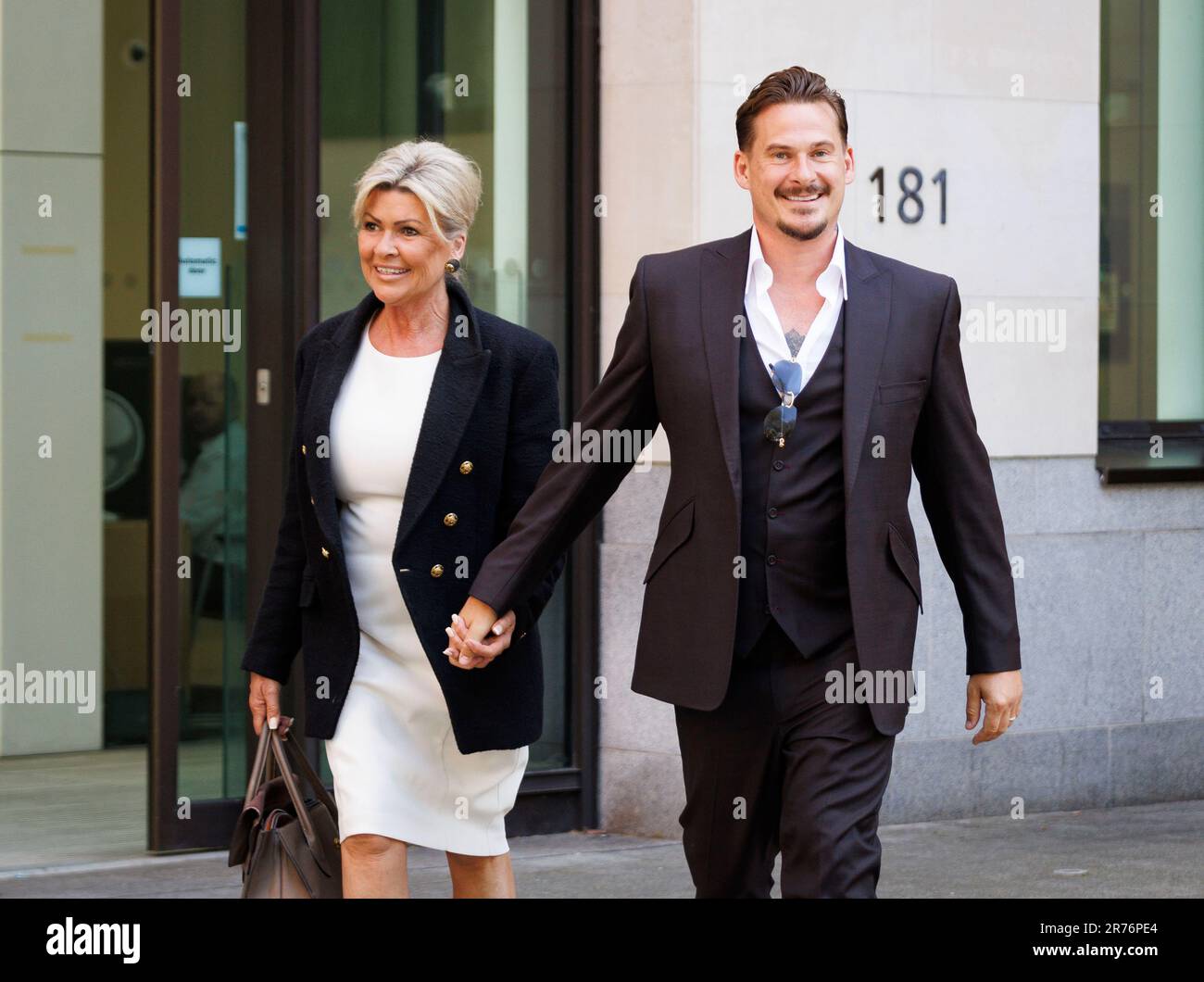 Lee Ryan leaves Westminster Magistrates' Court with his mother Sheila after applying to withdraw his guilty plea for drunkenly assaulting a police officer during his arrest for abusing a black flight attendant. Mr Ryan was found guilty at Ealing Magistrates' Court in January of racially aggravated common assault by beating and behaving in an abusive way towards the cabin crew member, while pleading guilty to assaulting a police officer by biting him. Picture date: Tuesday June 13, 2023. Stock Photo