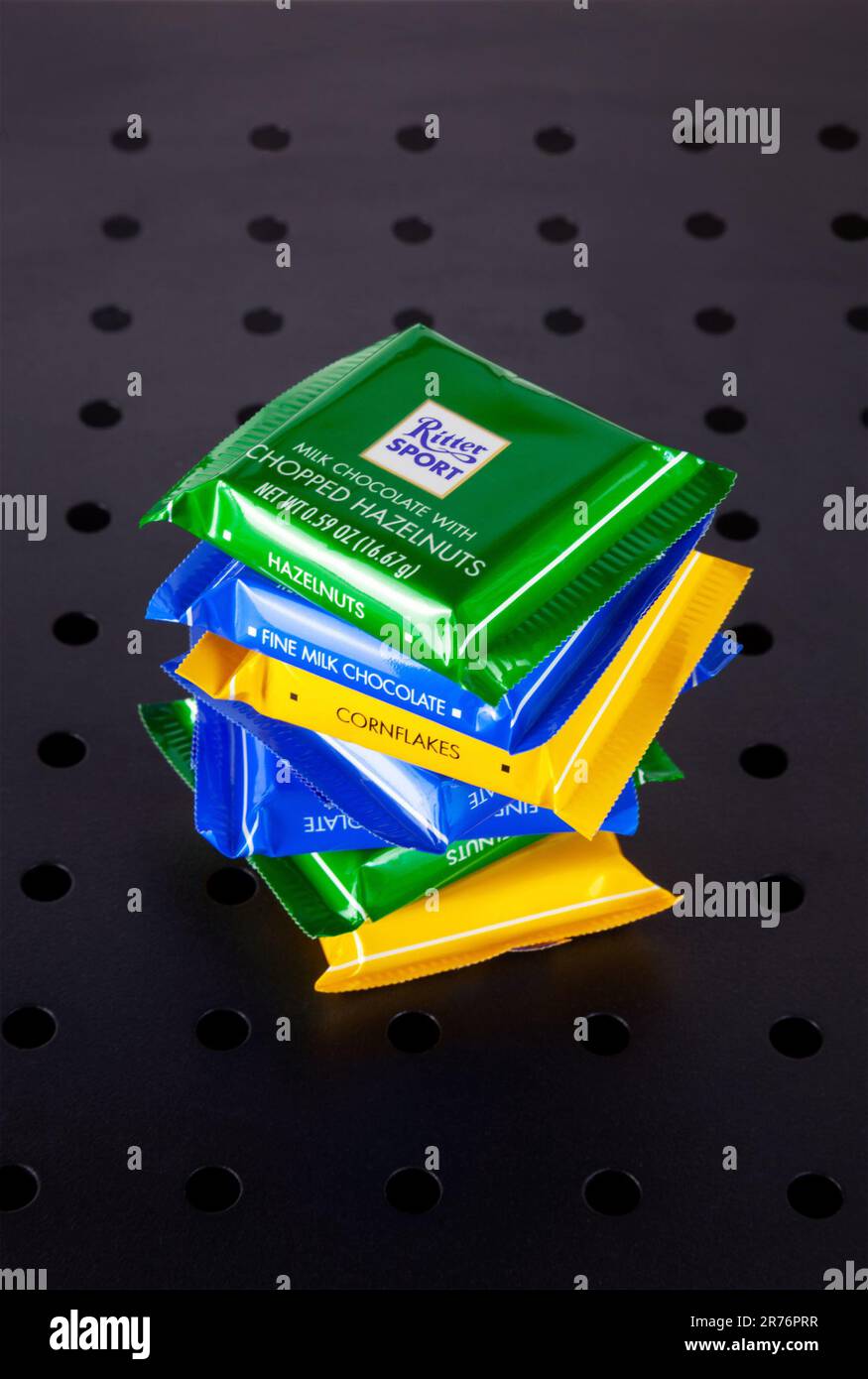 Ho Chi Minh City, Vietnam - June 13, 2023: Stack of mini chocolate bars of various flavors with Ritter Sport logo, isolated on black. A lot of candy o - Stock Image