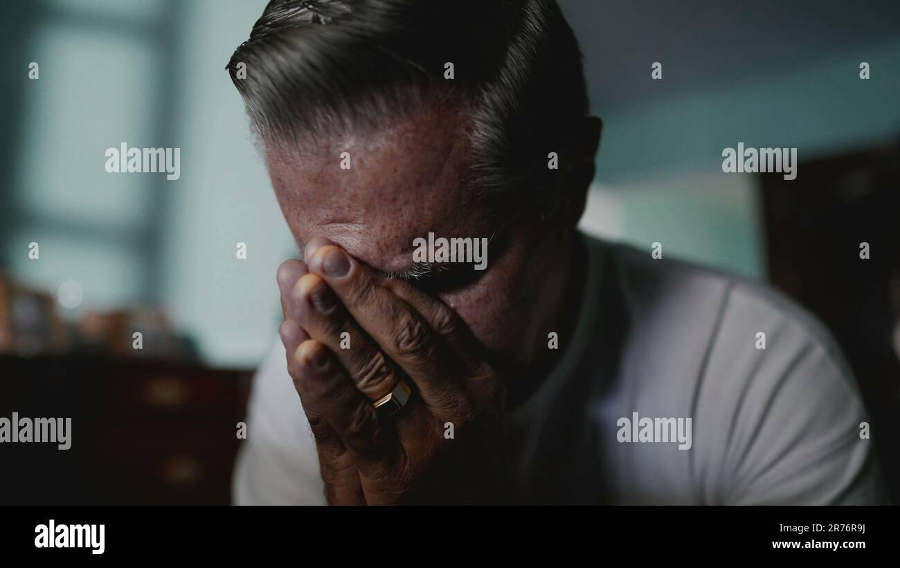 Preoccupied Images Preoccupied older man covering hi-res stock photography and images - Alamy