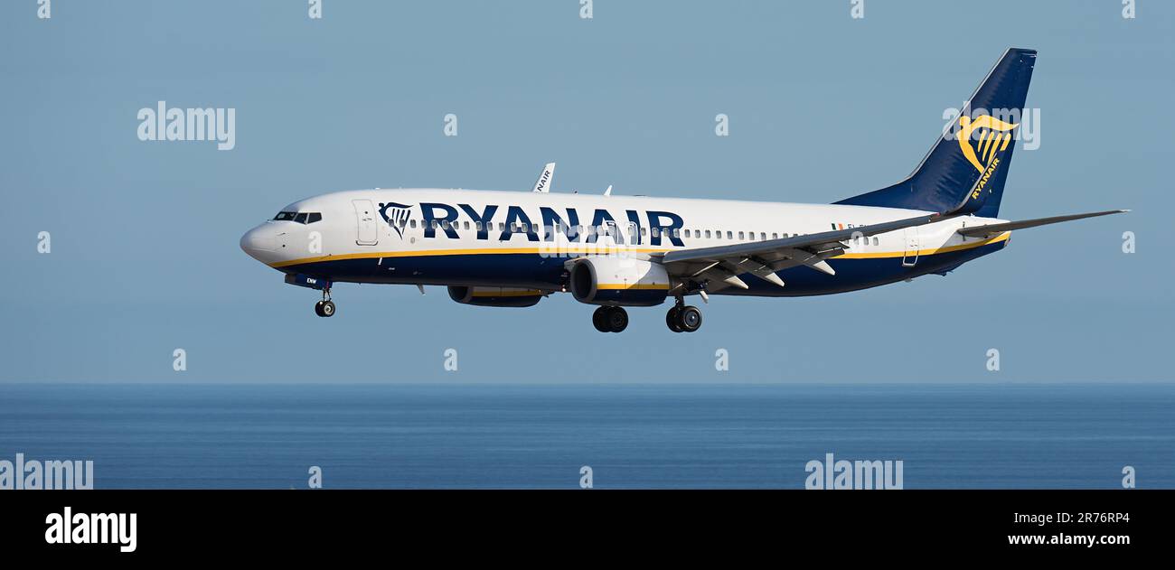 Tenerife, Spain June 4st, 2023. Boeing 737 of Ryanair Airlines flies in the blue sky over the ocean Stock Photo