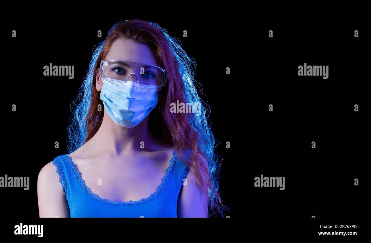 Woman wearing a safety mask and protective glasses Stock Photo Alamy