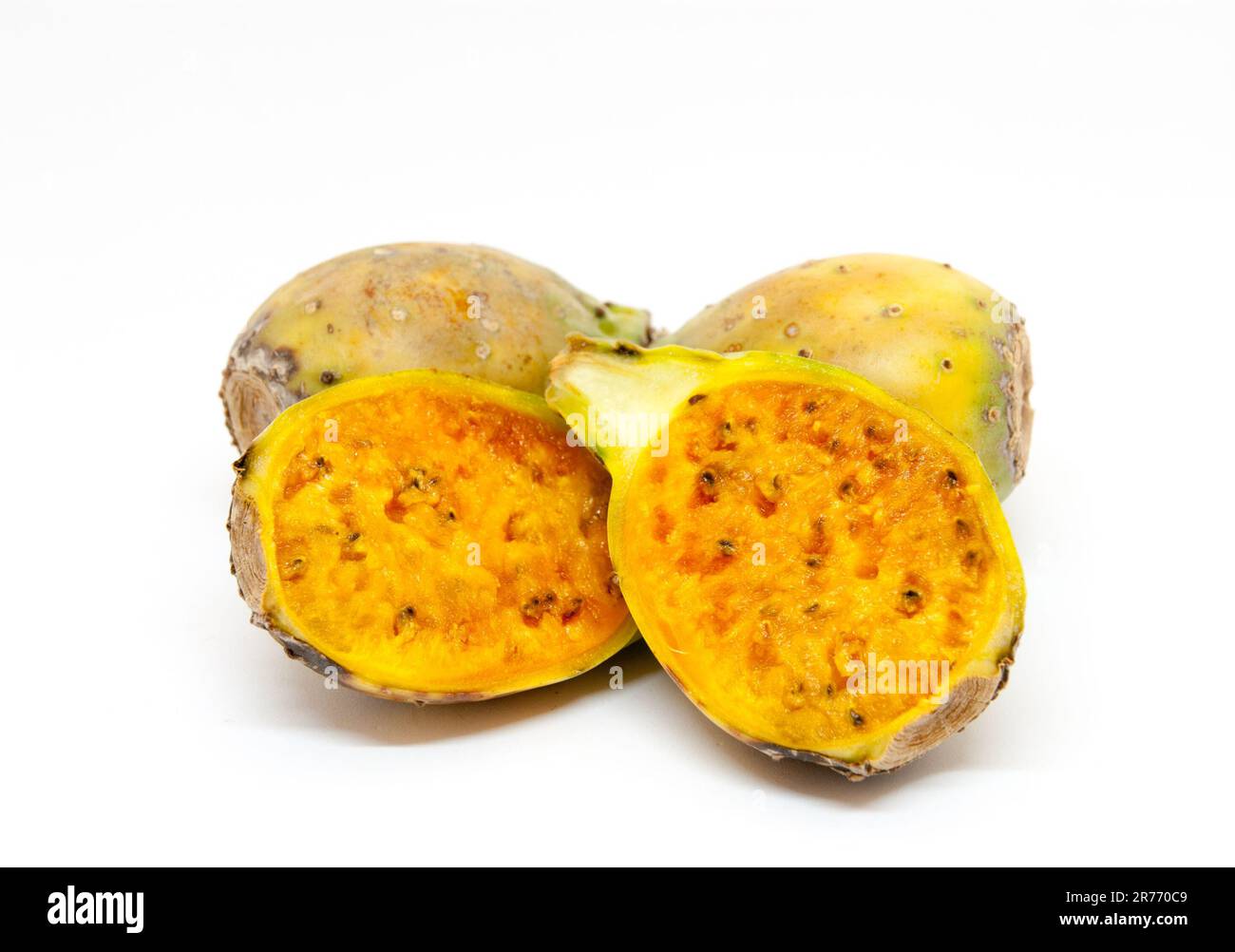 whole and sliced ripe cactus fruits over white background Stock Photo