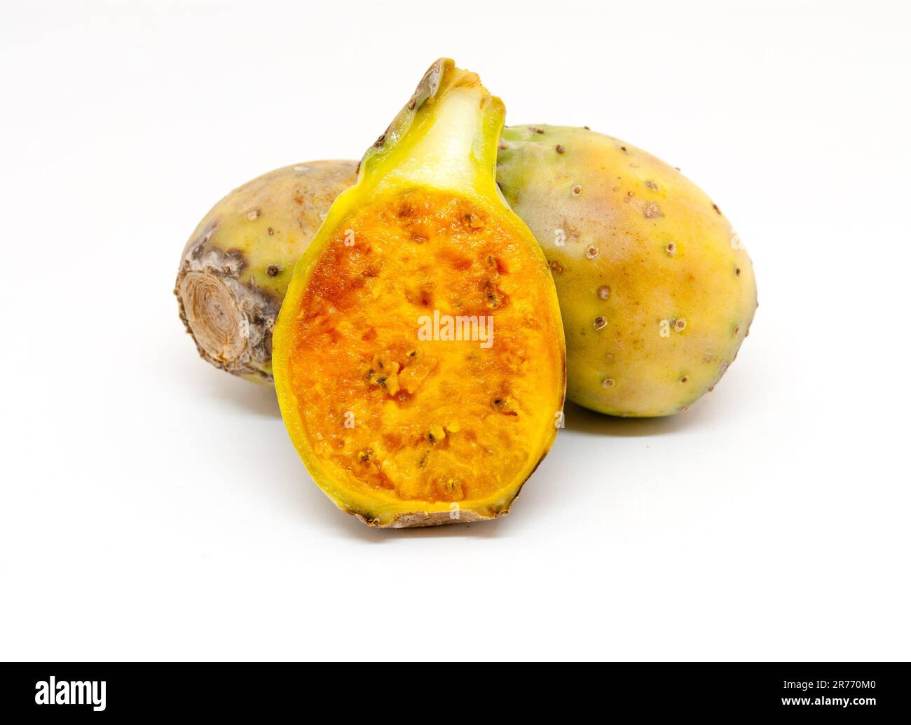 whole and sliced ripe cactus fruits over white background Stock Photo