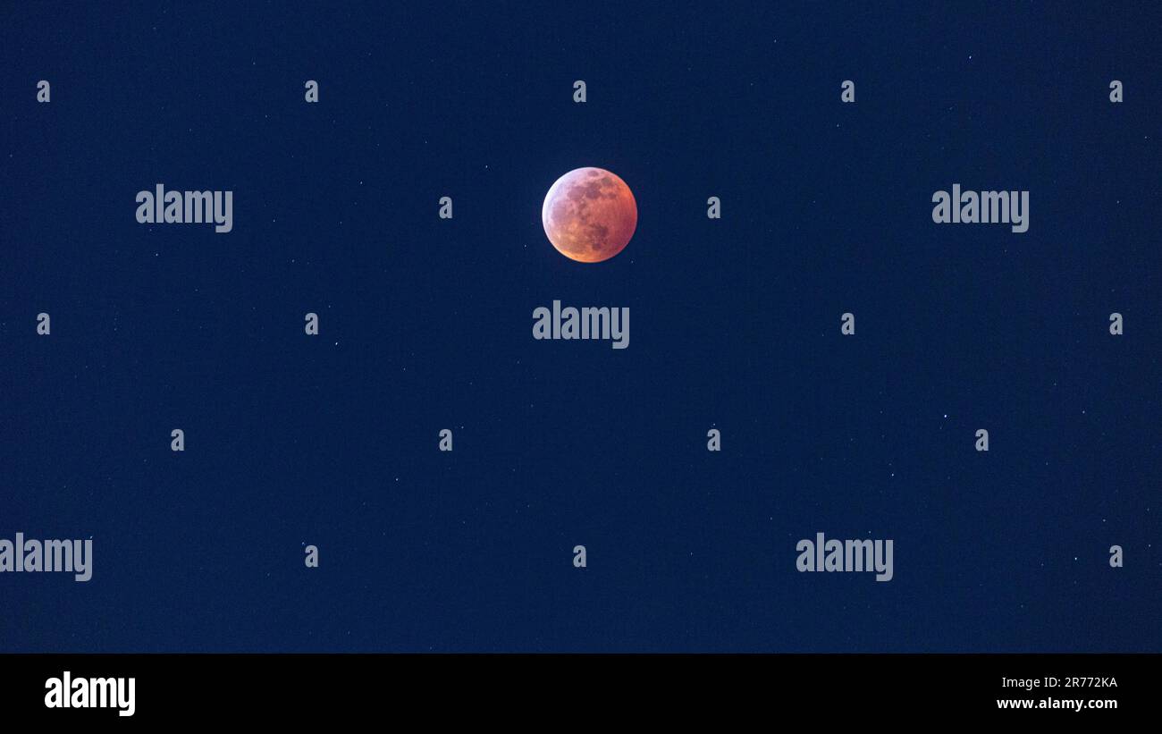 Close up picture of the blood moon during lunar eclipse at nighttime ...