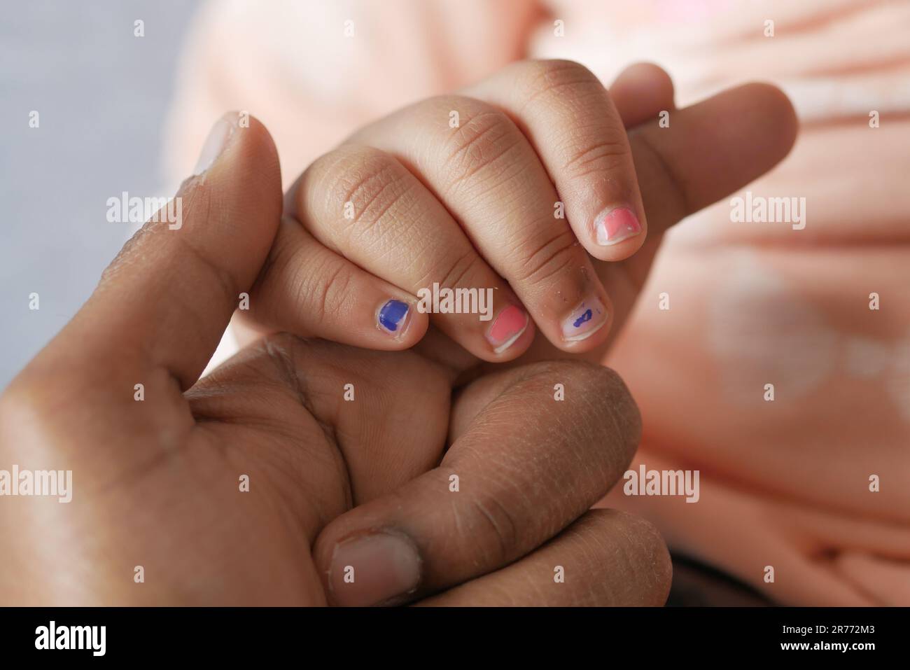 father holding hand of baby child, close up Stock Photo - Alamy