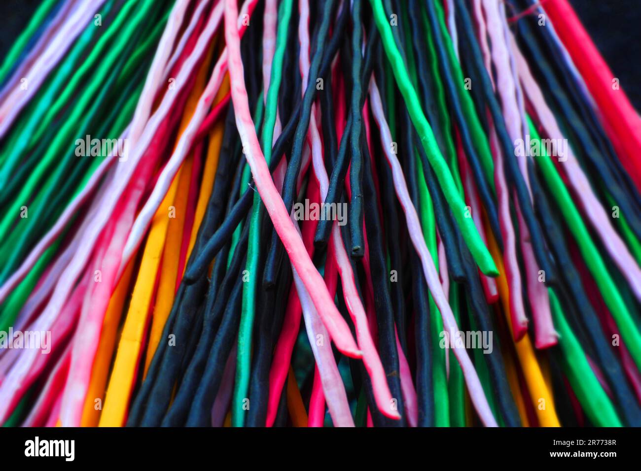 Multicolored plastic rods for recycling and recyclables. Background in