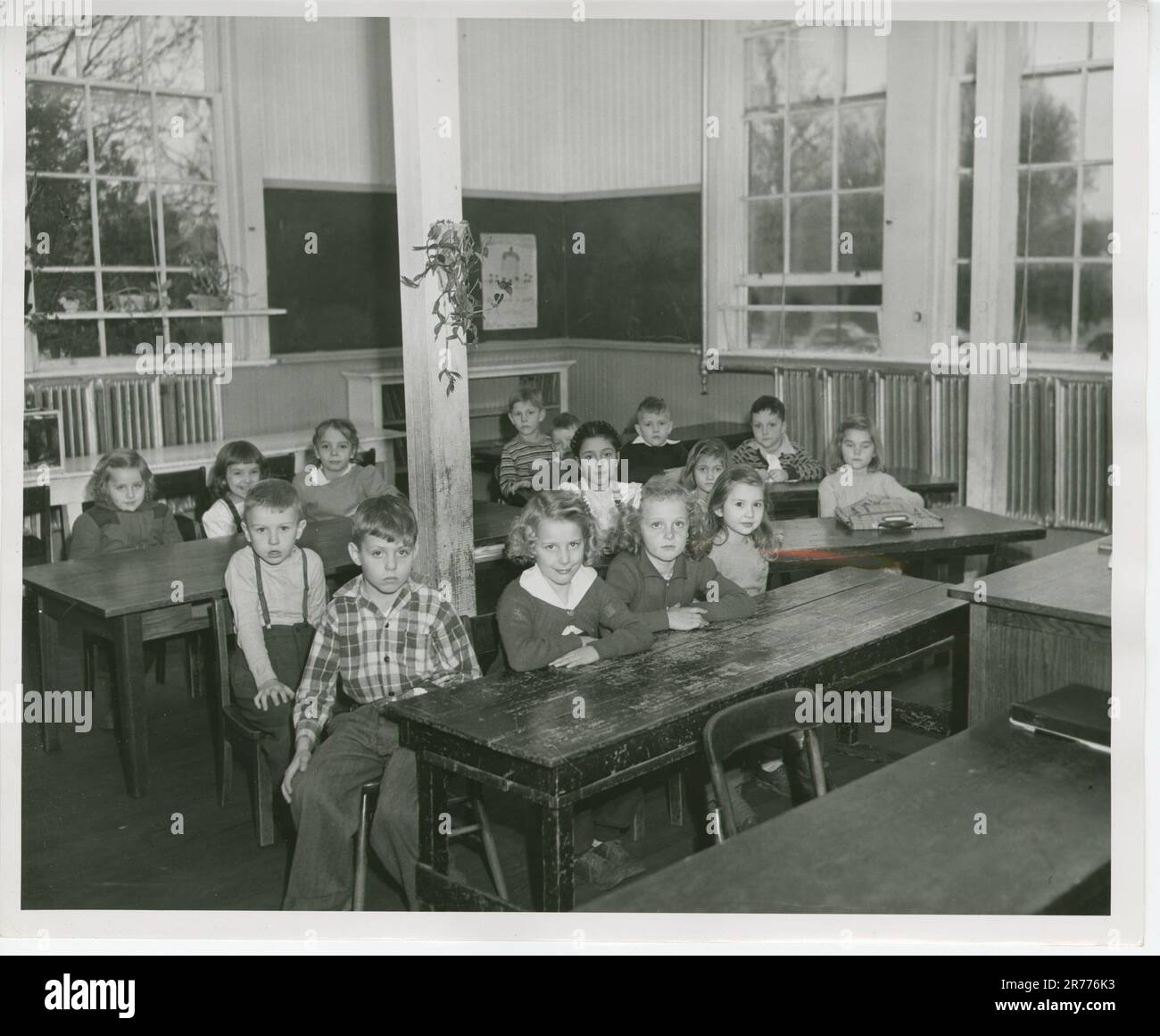 View of a Botetourt School Classroom; 1st Grade. This item is a photograph of a Botetourt School classroom for 1st grade; featuring students. This photograph was used as the Defendant's Exhibit No. 162 for the civil rights court case Alice Lorraine Ashley, et al. v. School Board of Gloucester Co. and J. Walter Kenny, Division Superintendent..  Mid Atlantic Region (Philadelphia, PA). Photographic Print. Stock Photo