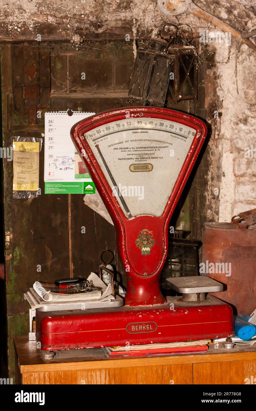 still life of red old fashioned scale Stock Photo - Alamy