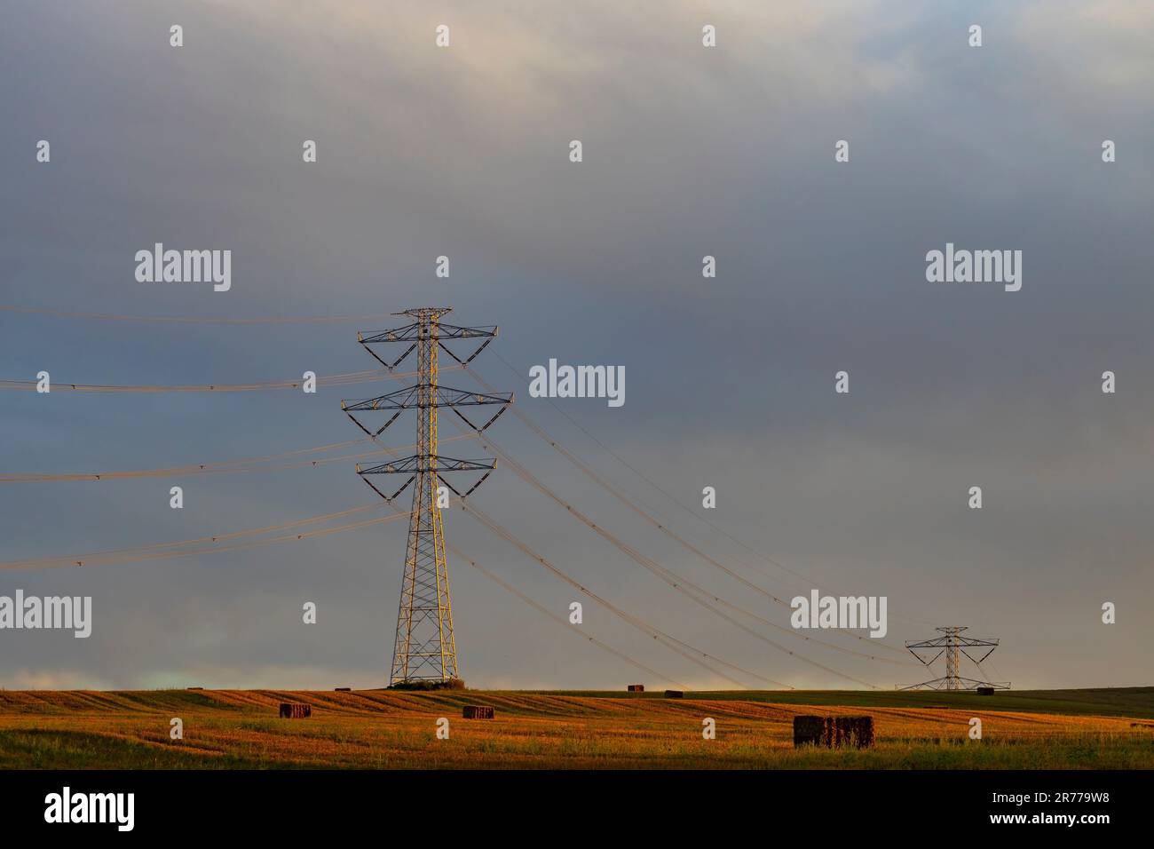 high voltage electric pylon with blue sky Stock Photo - Alamy