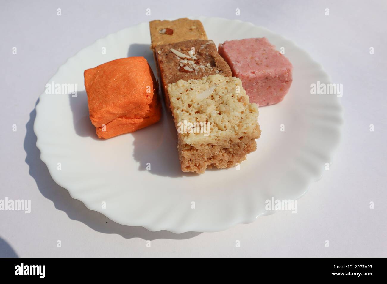 Assorted Indian sweets for festivals. Soan papdi, rose sohan papdi, burfi, mohanthal, kopra pak Stock Photo