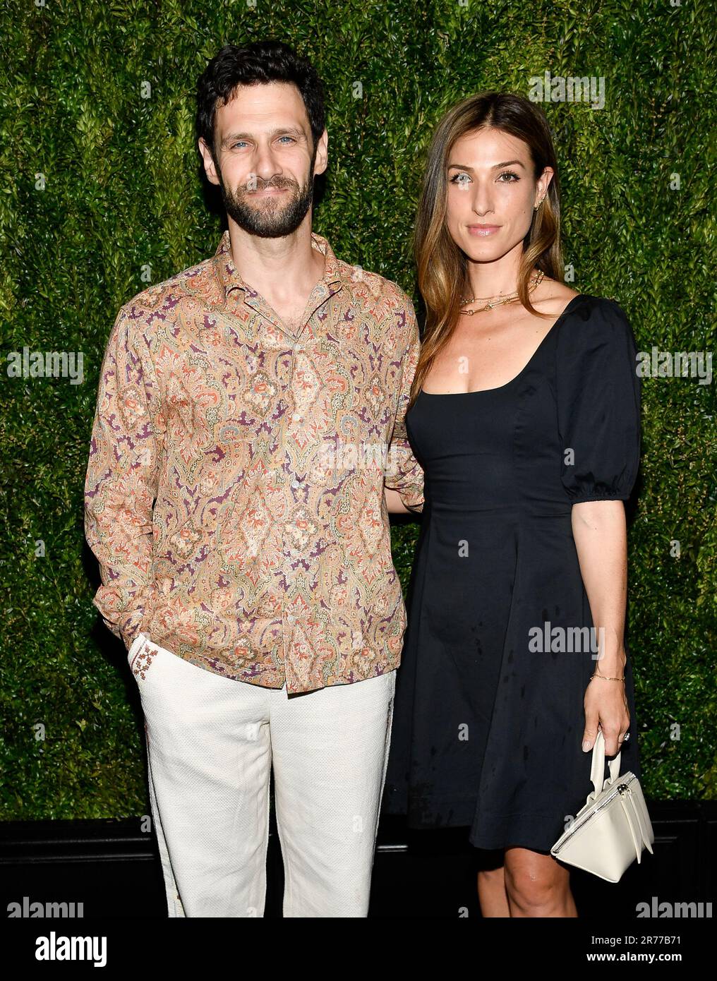 Justin Bartha, left, and wife Lia Bartha attend the 16th annual Chanel