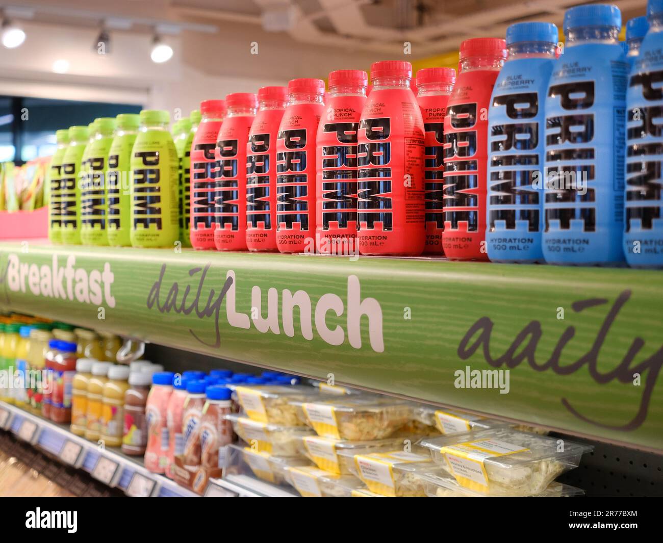 Bottles of Prime hydration energy drink on the shelves of a UK store. A