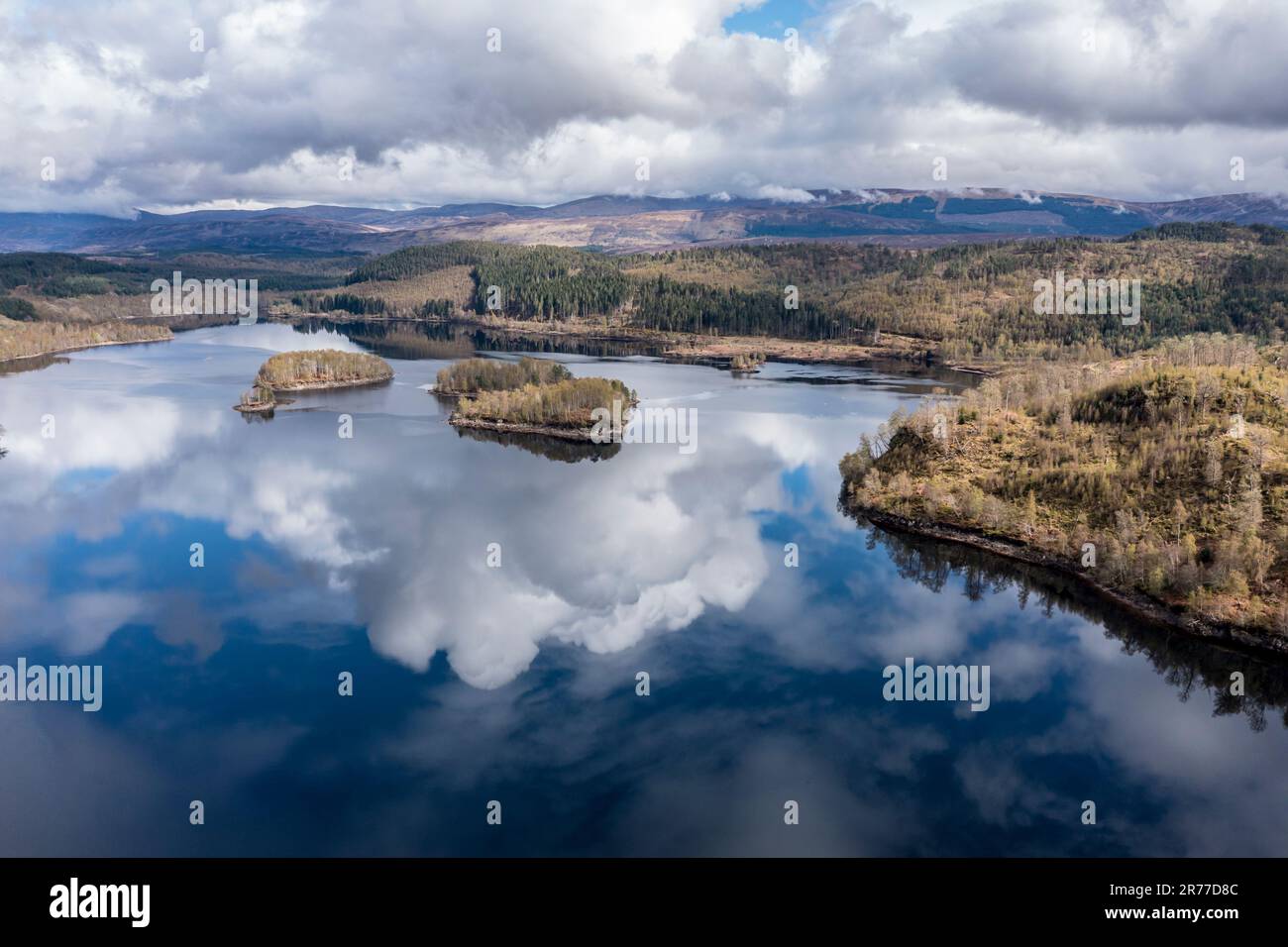 Clouds reflected in lake Loch Garry, islands on the mirrored sky,  scottish highlands, aerial view, Scotland, UK Stock Photo