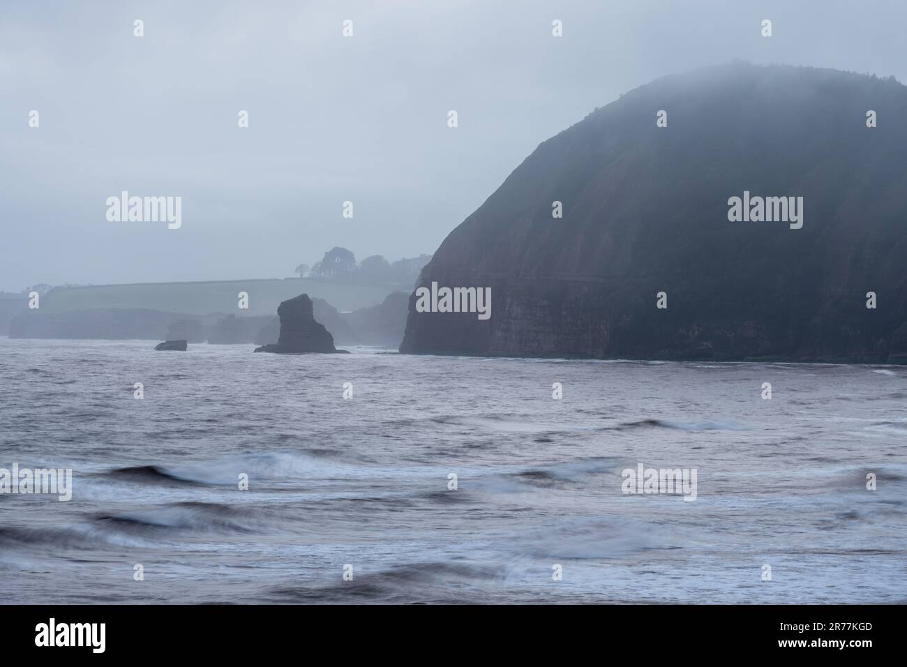 The cliffs of High Peak Hill and Picket Rocks rise from Ladram Bay on