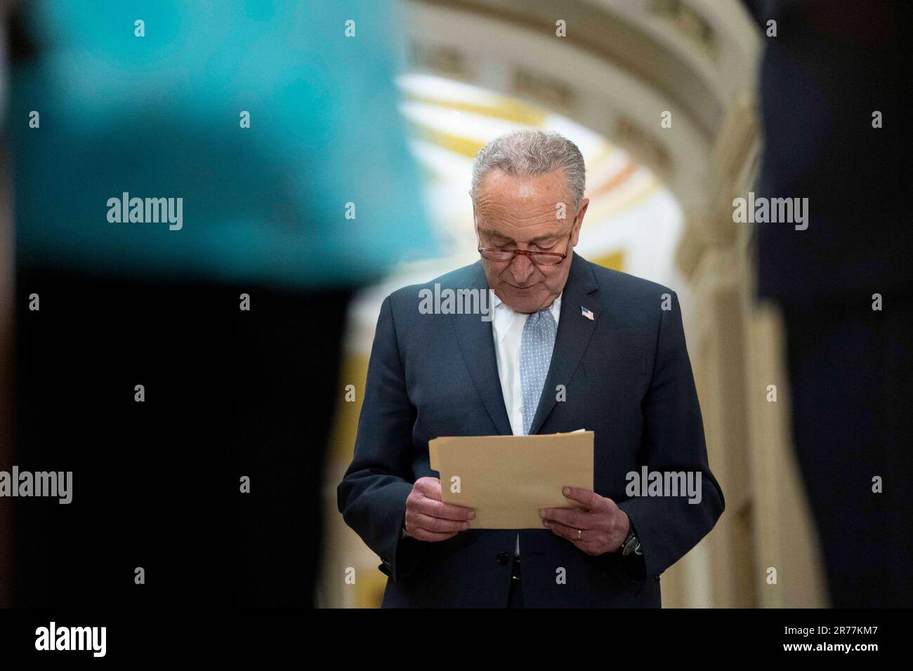 Washington, United States. 13th June, 2023. Senate Majority Leader Chuck Schumer, D-NY, reads papers during a press conference after weekly caucus luncheons at the U.S. Capitol in Washington, DC on Tuesday, June 13, 2023. Photo by Bonnie Cash/UPI Credit: UPI/Alamy Live News Stock Photo
