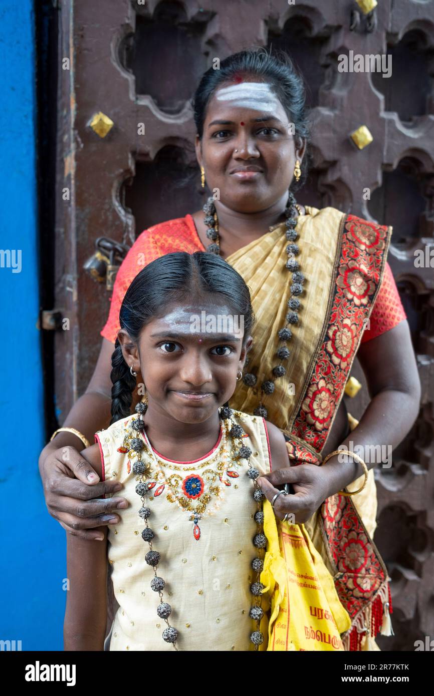 Hindu pilgrim mother and daughter arrive to worship at Mylporee