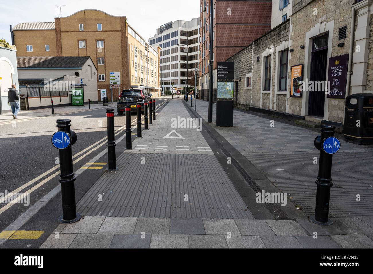 A segregated cycle lane in the town centre of Swindon in Wiltshire, England. Stock Photo