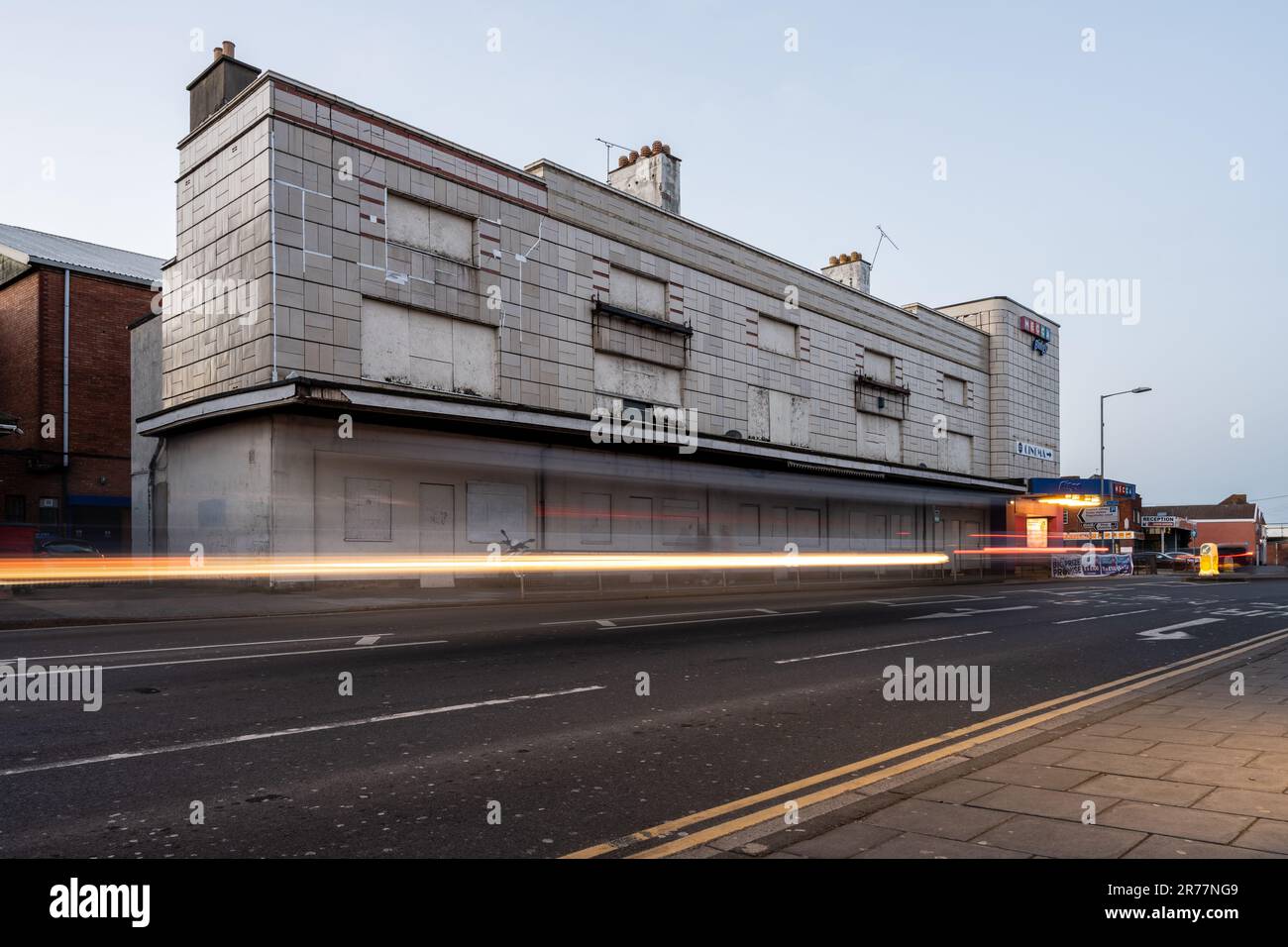 The disused Odeon Cinema building, designed by Thomas Cecil Howitt, stands boarded up and semi-derelict in Bridgwater, Somerset. Stock Photo