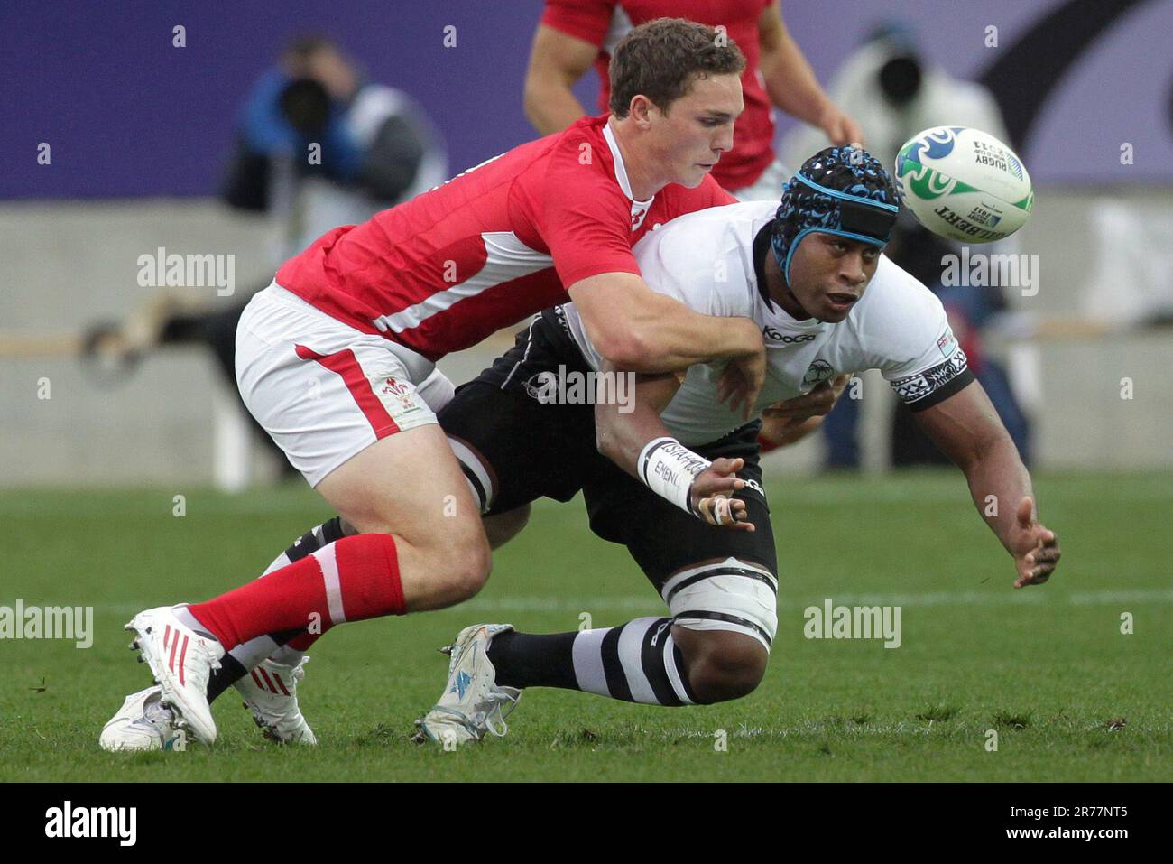 Wales George North tackles Fiji’s Wame Lewaravu during a Pool D match of the Rugby World Cup 2011, Waikato Stadium, Hamilton, New Zealand, Sunday, October 02, 2011. Stock Photo