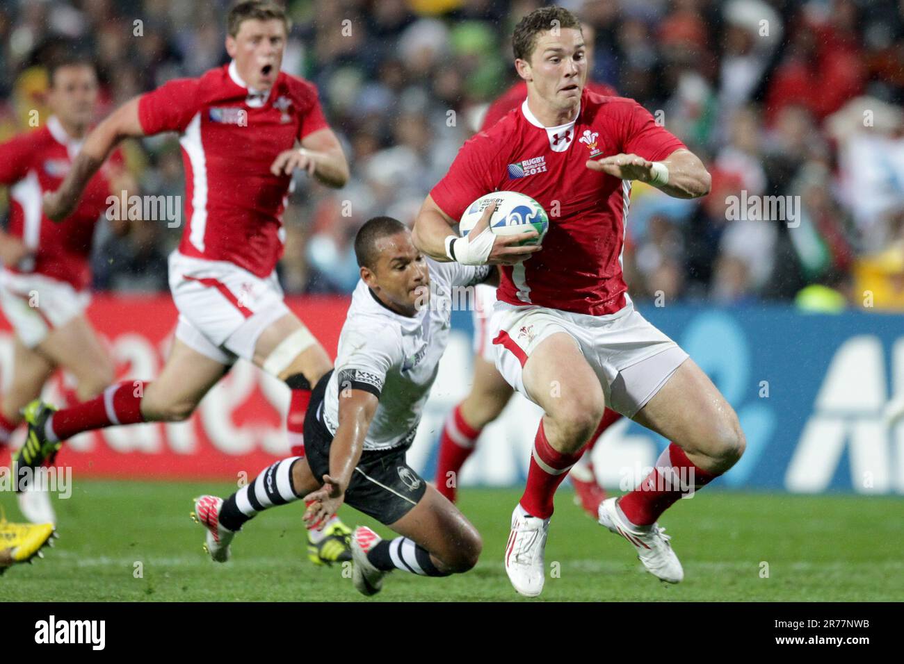 Fiji’s Vitori Tomu Buatava chases Wales George North during a Pool D match of the Rugby World Cup 2011, Waikato Stadium, Hamilton, New Zealand, Sunday, October 02, Stock Photo