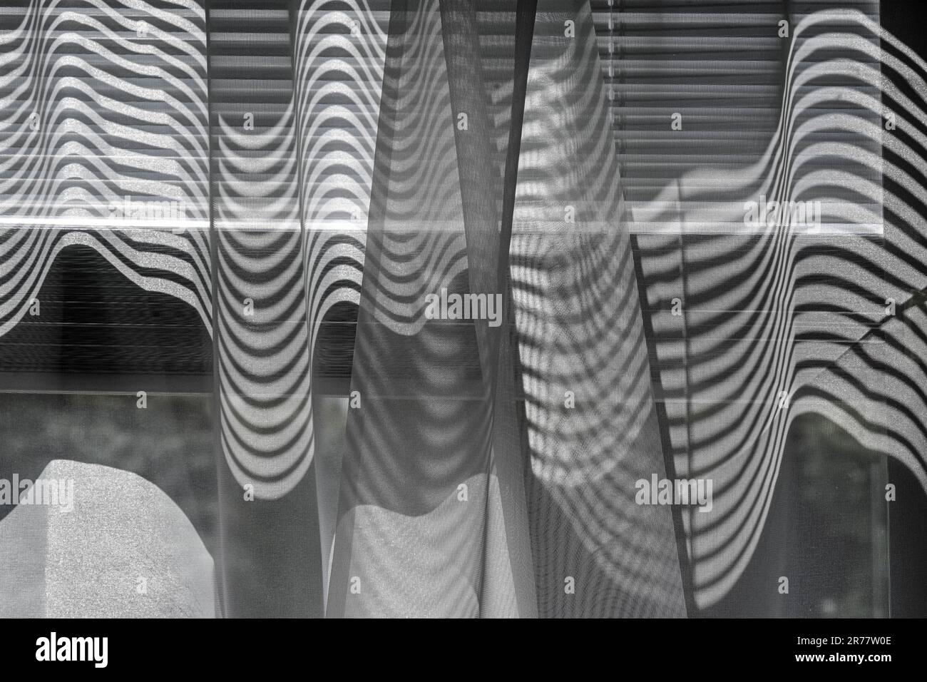 Shadowgraph Curtain Abstract pattern formed by shadows and light through window shades onto ...