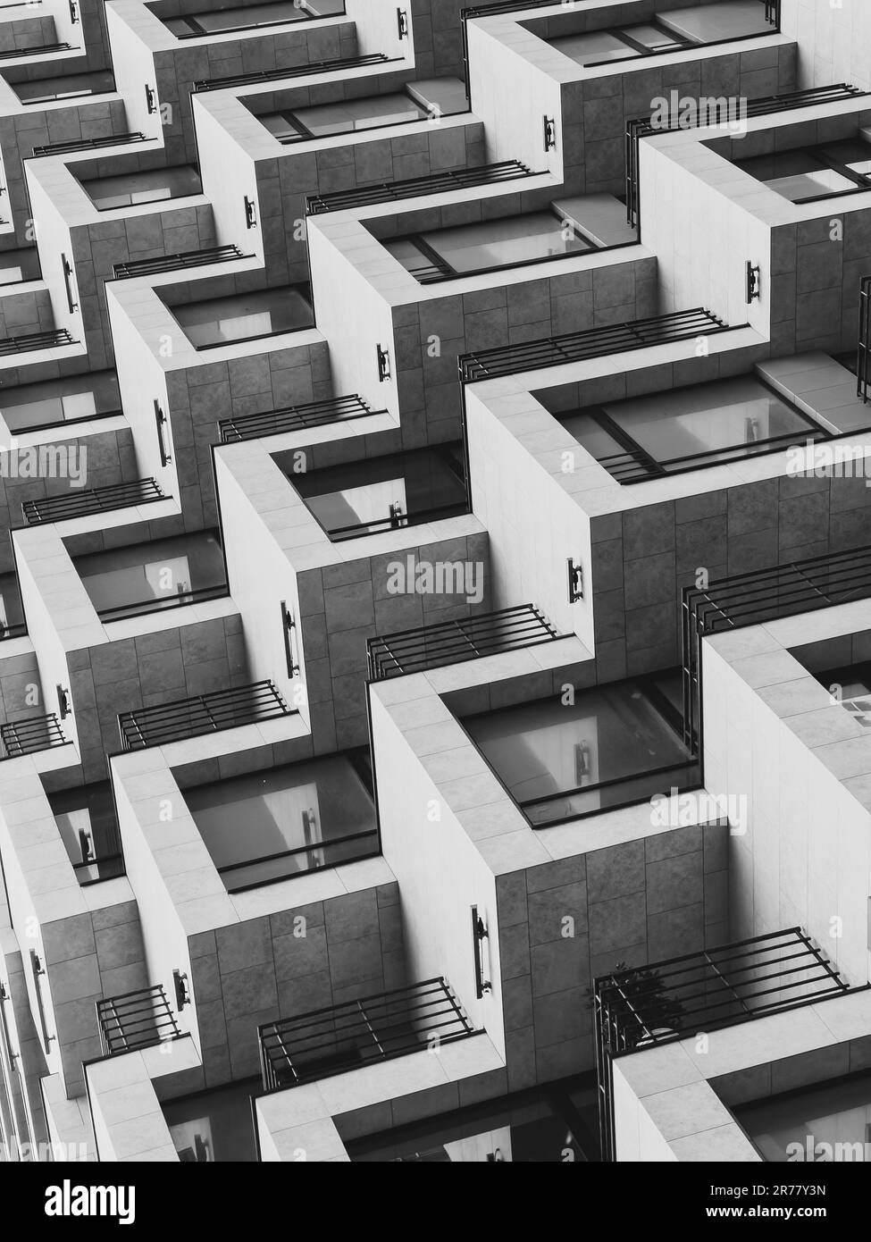 From below of black and white of modern geometric residential building ...
