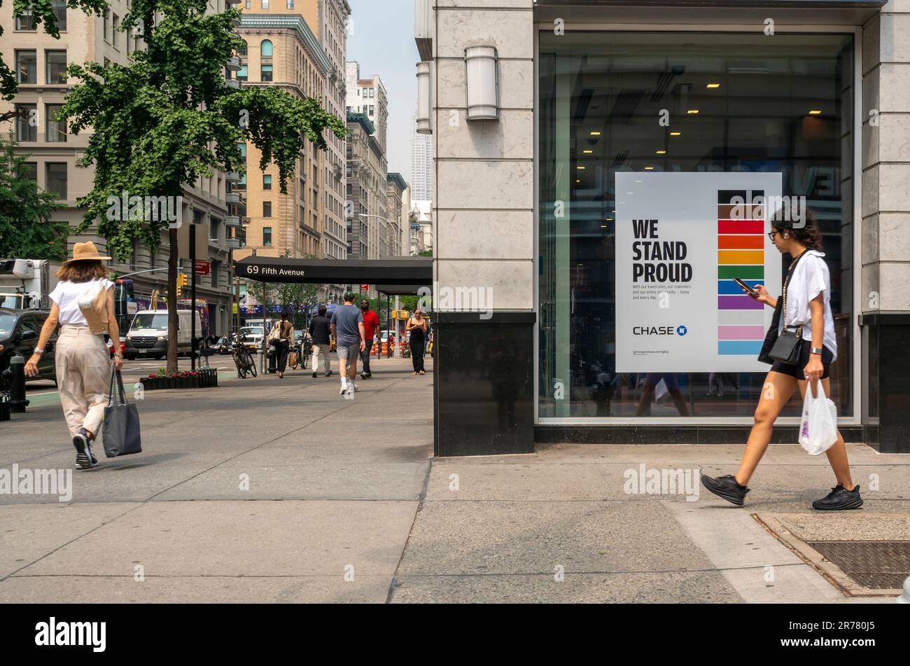 A sign in the window of a Chase bank in the Flatiron neighborhood in New York displays rainbow colors and their support of Gay Pride, seen on Tuesday, June 6, 2023.  (© Richard B. Levine) Stock Photo