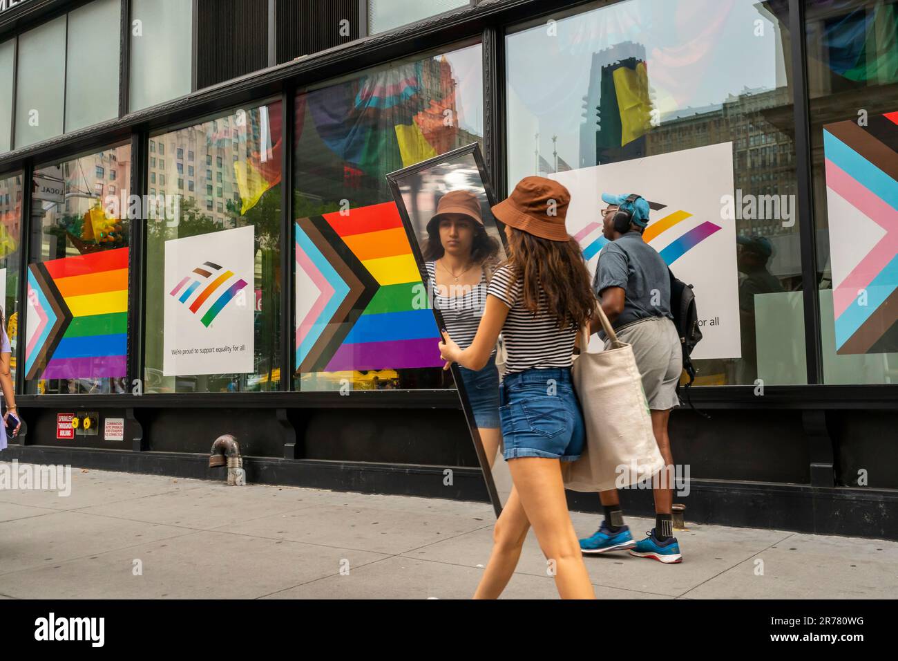 The window of a Bank of America branch in the Flatiron neighborhood in New York displays the Progress Pride Flag and rainbow colors for their support of Gay Pride, seen on Sunday, June 11, 2023.  (© Richard B. Levine) Stock Photo