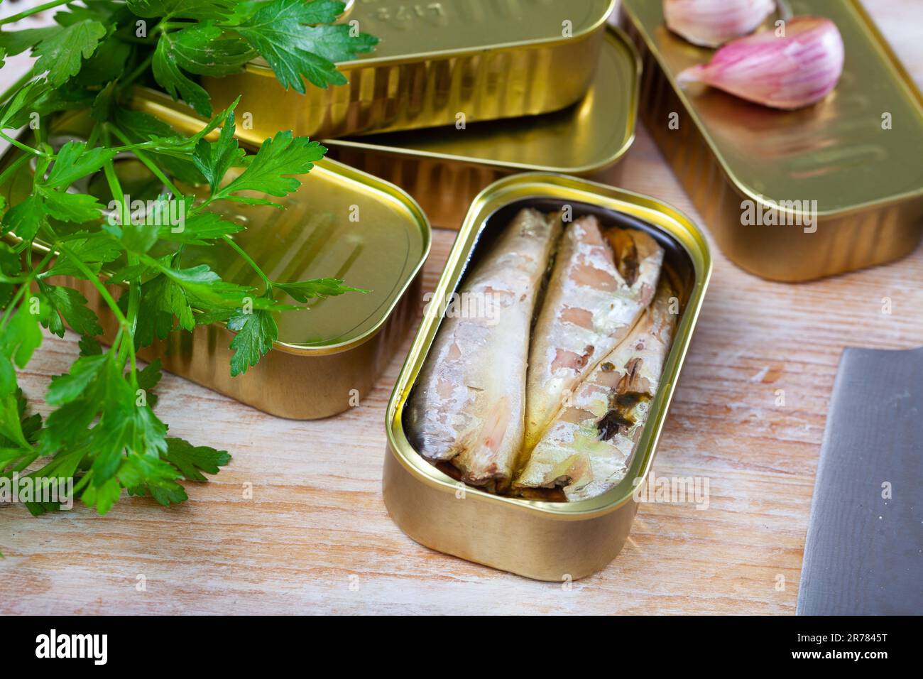 Salty fillet of mackerel in sunflower oil in open tin can Stock Photo