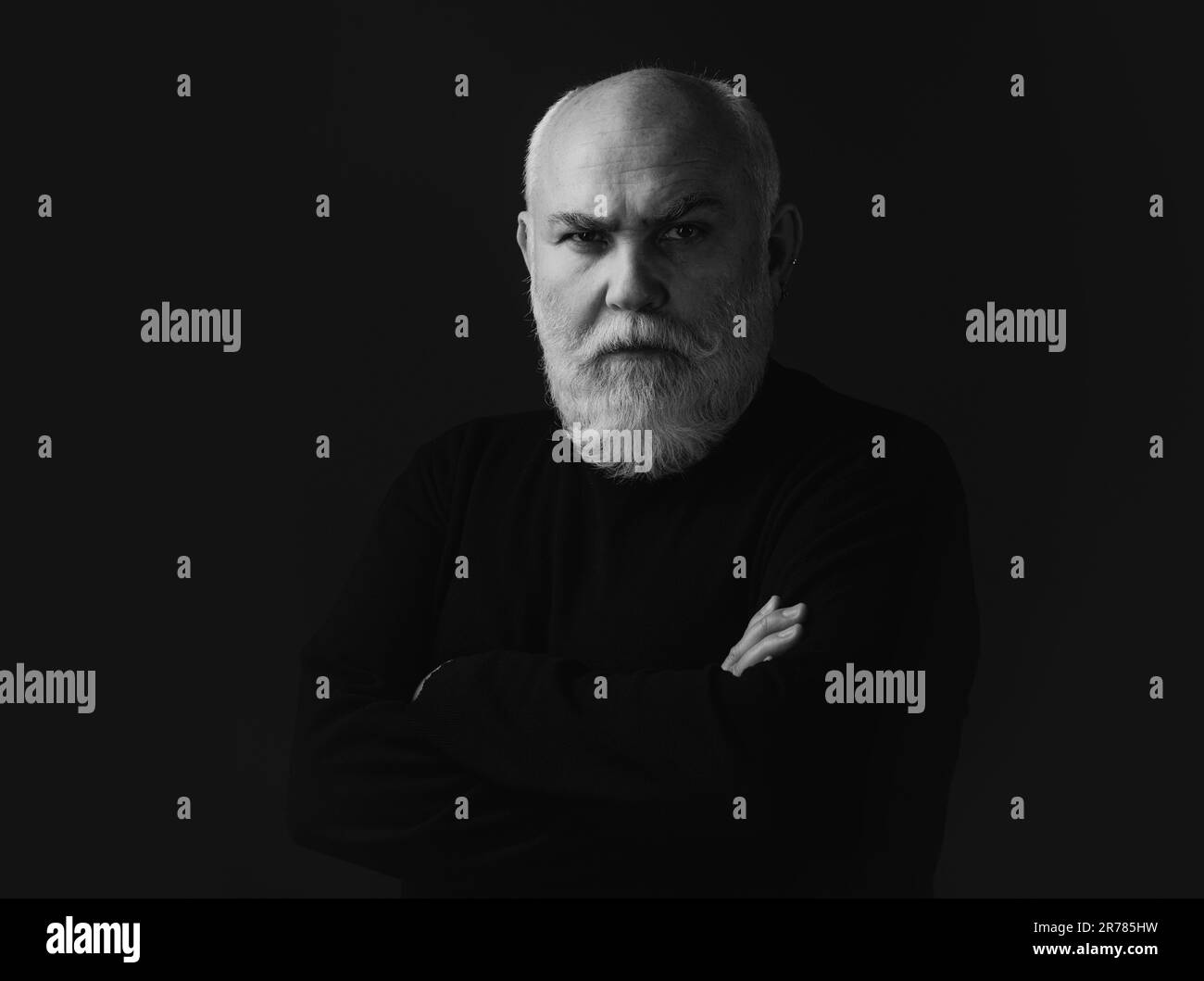 Close up portrait of an elegant senior man with grey hair isolated on