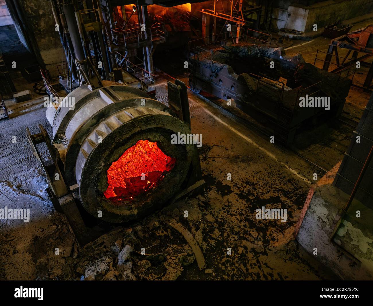 Bucket with cooling down hot slag in metallurgical plant. Stock Photo