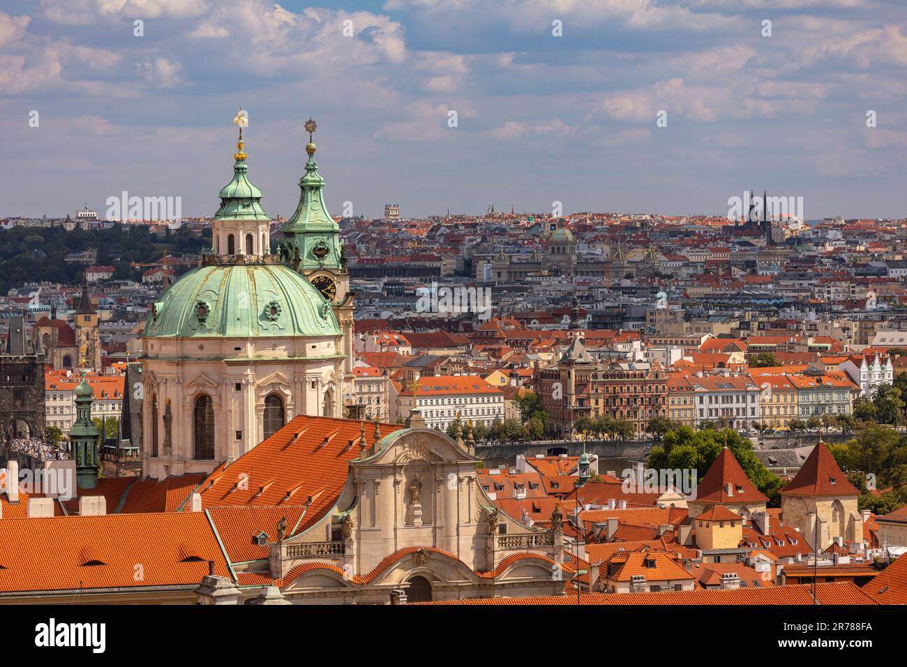 PRAGUE, CZECH REPUBLIC, EUROPE - St. Nicholas church, a Baroque church in the Lesser Town of Prague, and view of city. Stock Photo