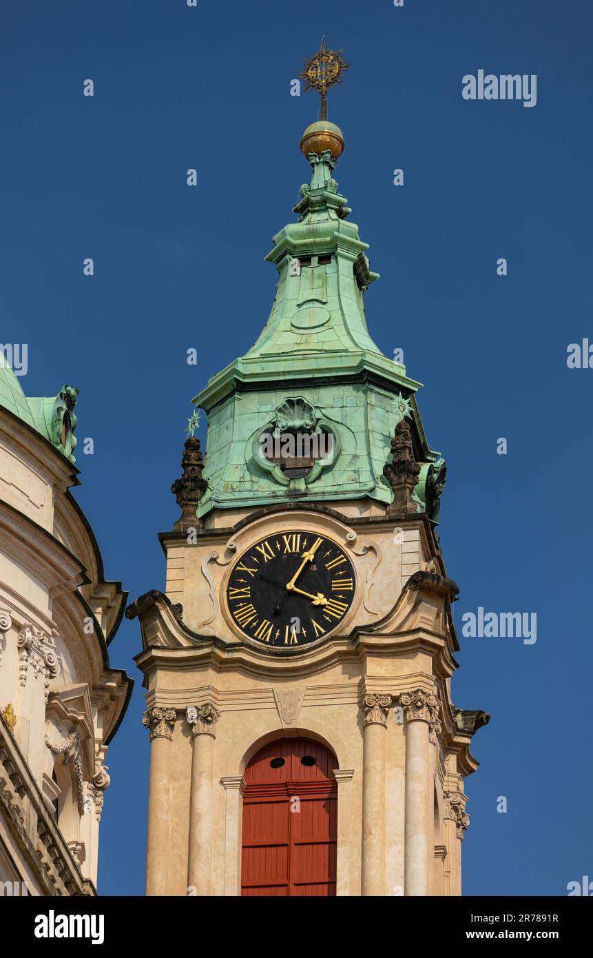 PRAGUE, CZECH REPUBLIC, EUROPE - Clock tower of St. Nicholas church, a Baroque church in the Lesser Town of Prague. Stock Photo
