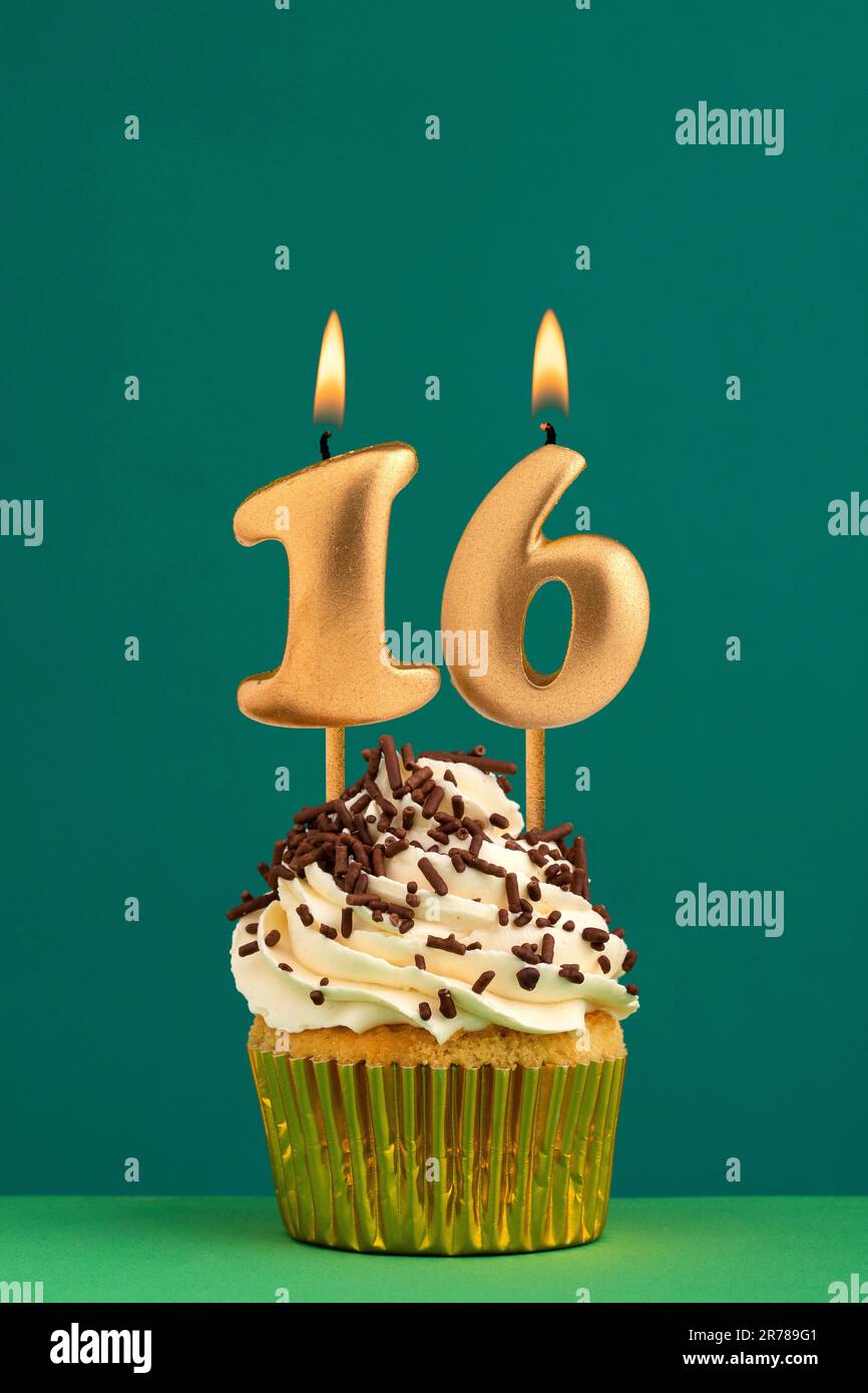 Birthday card with candle number 16 - Green background Stock Photo