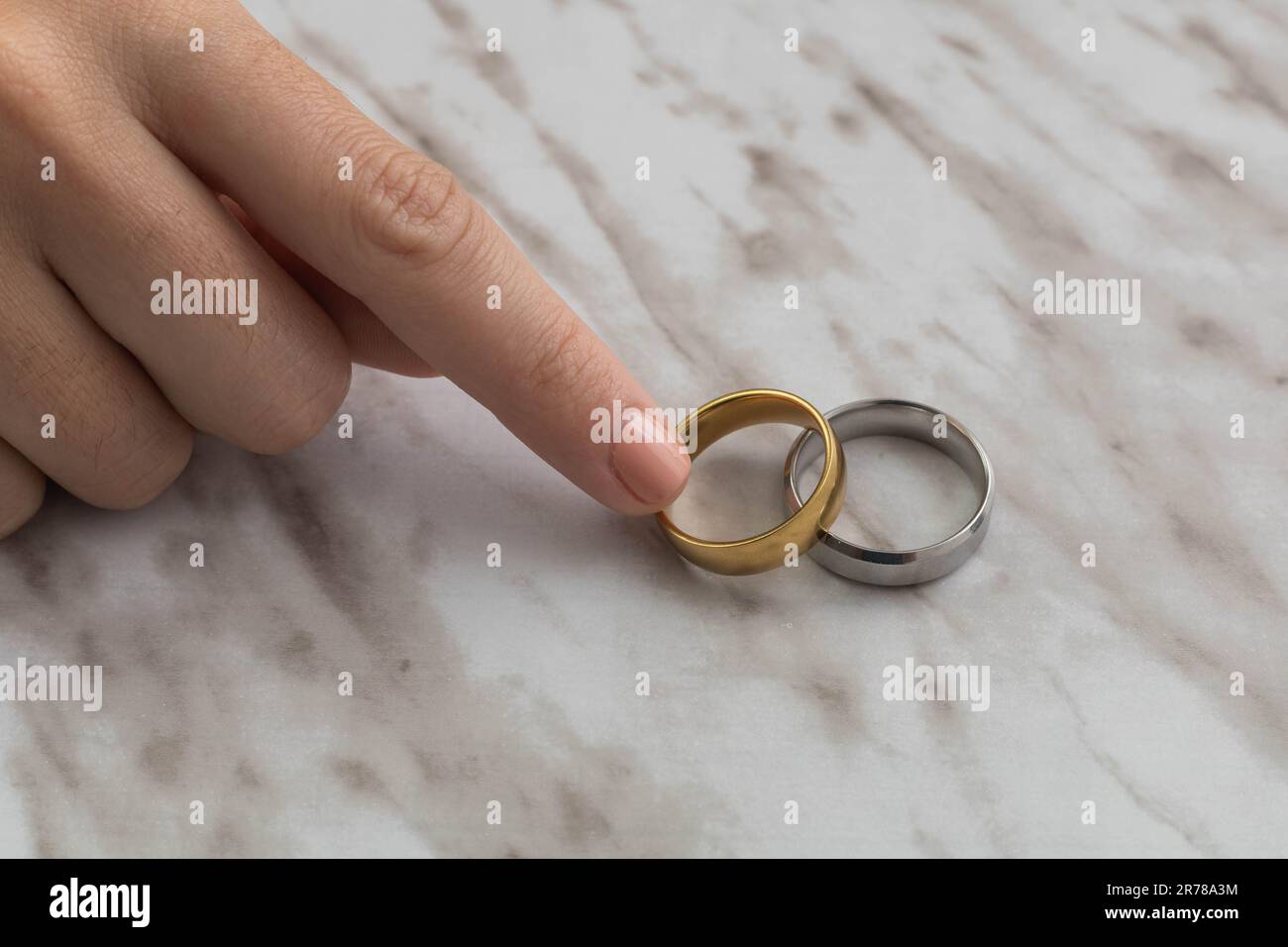 person hand taking engagement rings in studio, beautiful jewelry with