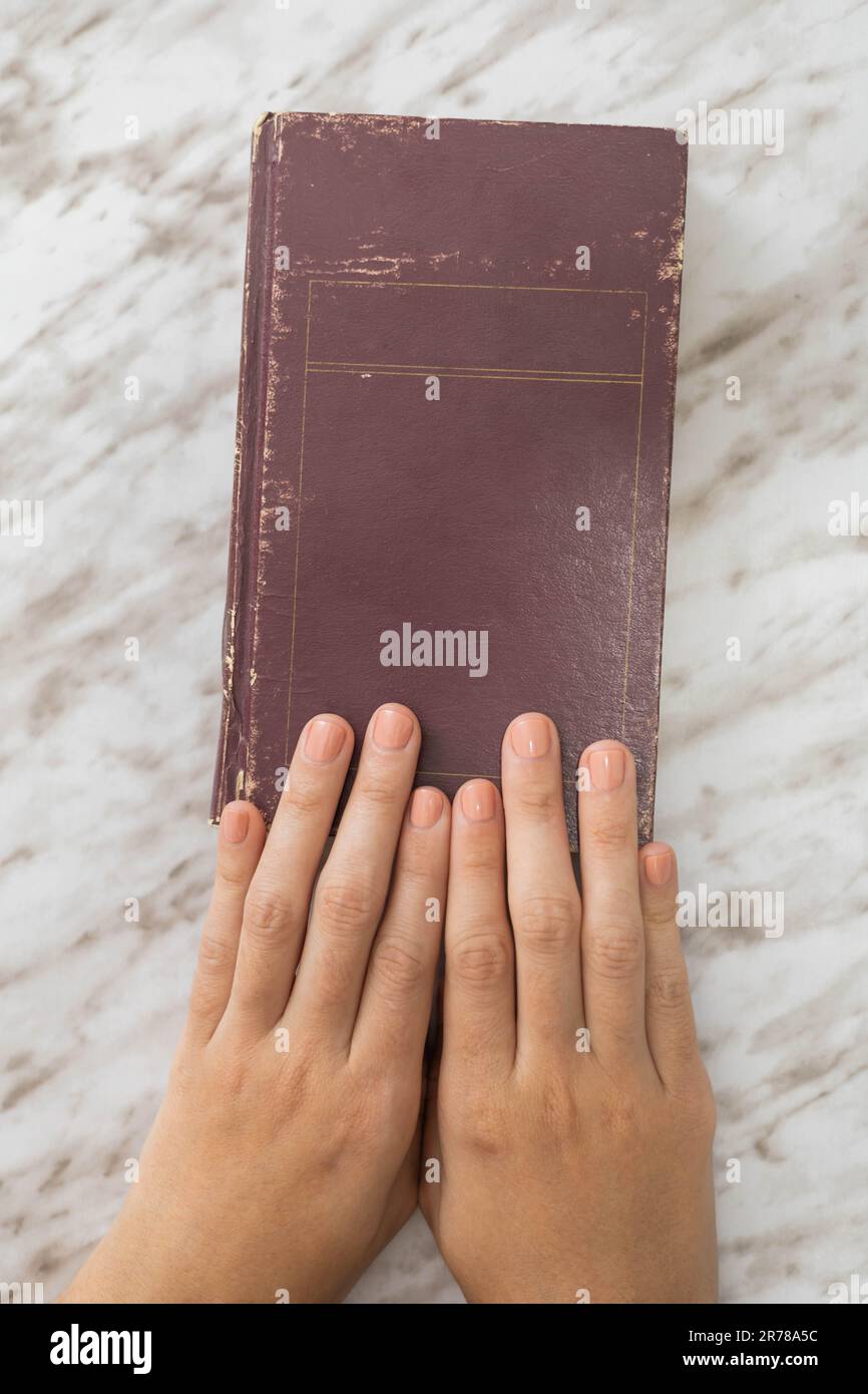 old book cover and hands holding it, texture and object for learning ...