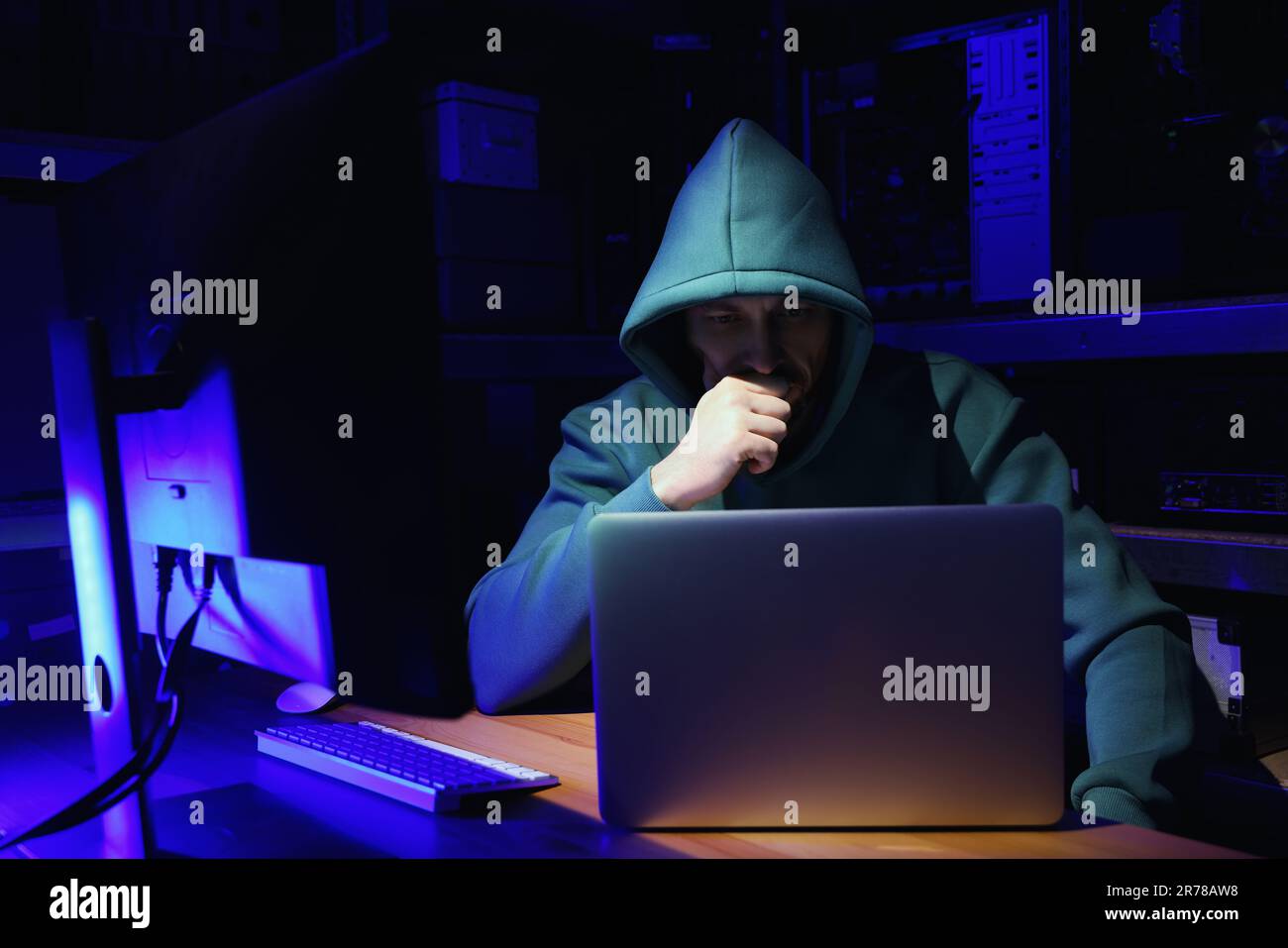 Hacker working with computers in dark room. Cyber attack Stock Photo